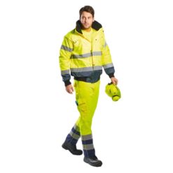 Kurtka Ostrzegawcza Bomber Portwest C465 ocieplana z kołnierzem futrzanym przeciwdeszczowa plamoodporna wodoodporna bomberka bhp drogowa do pracy żółto granatowa na modelu