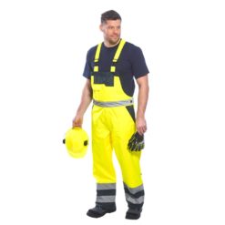 Spodnie Ogrodniczki Ostrzegawcze Portwest S489 Ocieplane 2 kolory do pracy bhp odzież robocza ocieplana zimowa jesienna szwedy odblaskowe na szelkach żółte model przód
